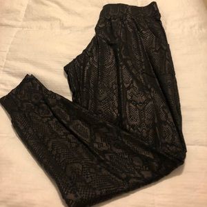 Black snakeskin joggers